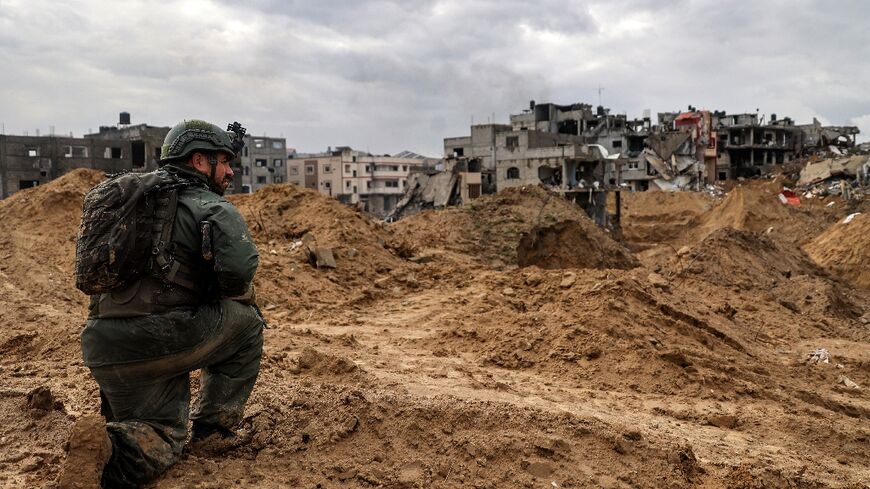 This picture taken during a media tour organised by the Israeli military on January 27, 2024, shows an Israeli soldier during a patrol in Gaza's main southern city of Khan Yunis