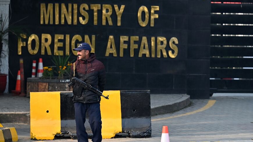 A police officer stands guard outside Pakistan's foreign ministry in Islamabad on January 18, 2024